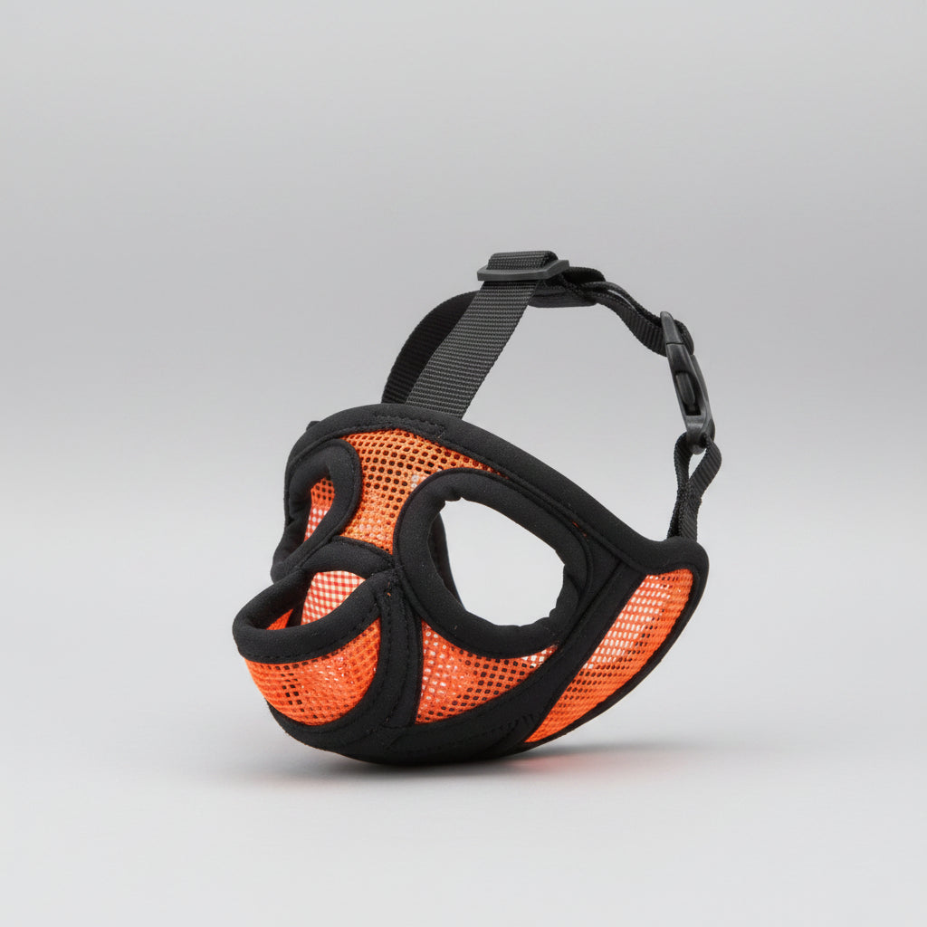 Black and orange dog muzzle with mesh design on a white background