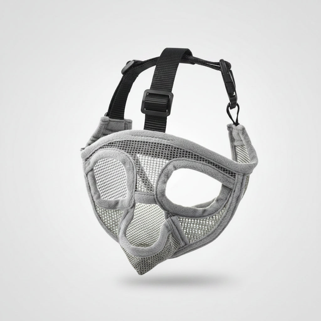 Gray mesh dog muzzle with black straps on a white background