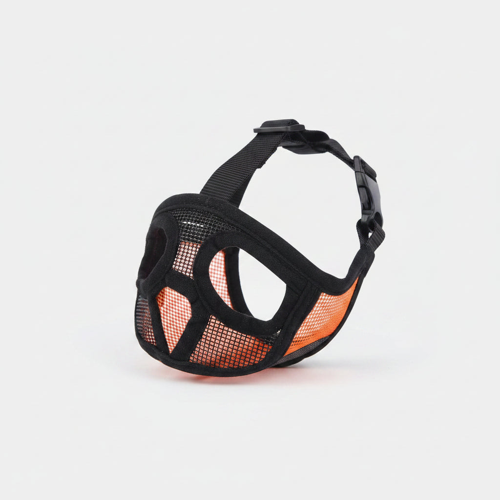 Black mesh dog muzzle with pink accents on a white background