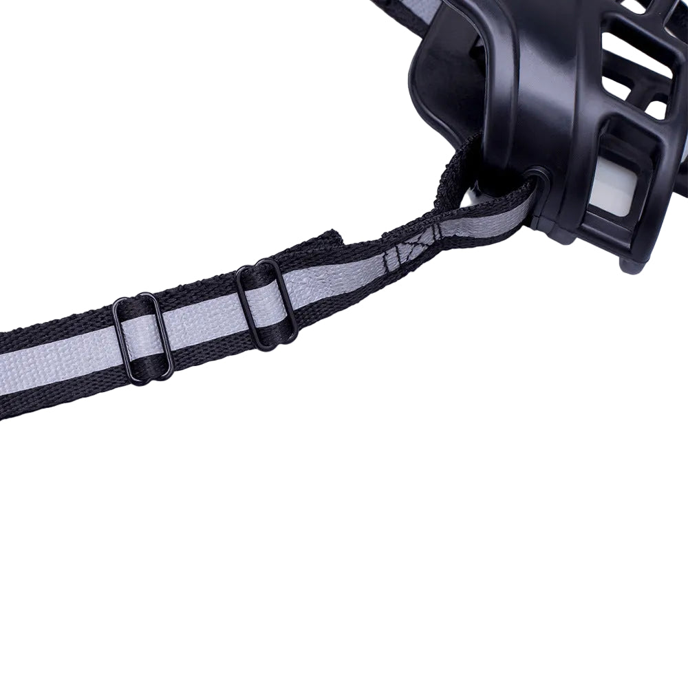 Close-up of a black and gray headlamp with strap on a white background