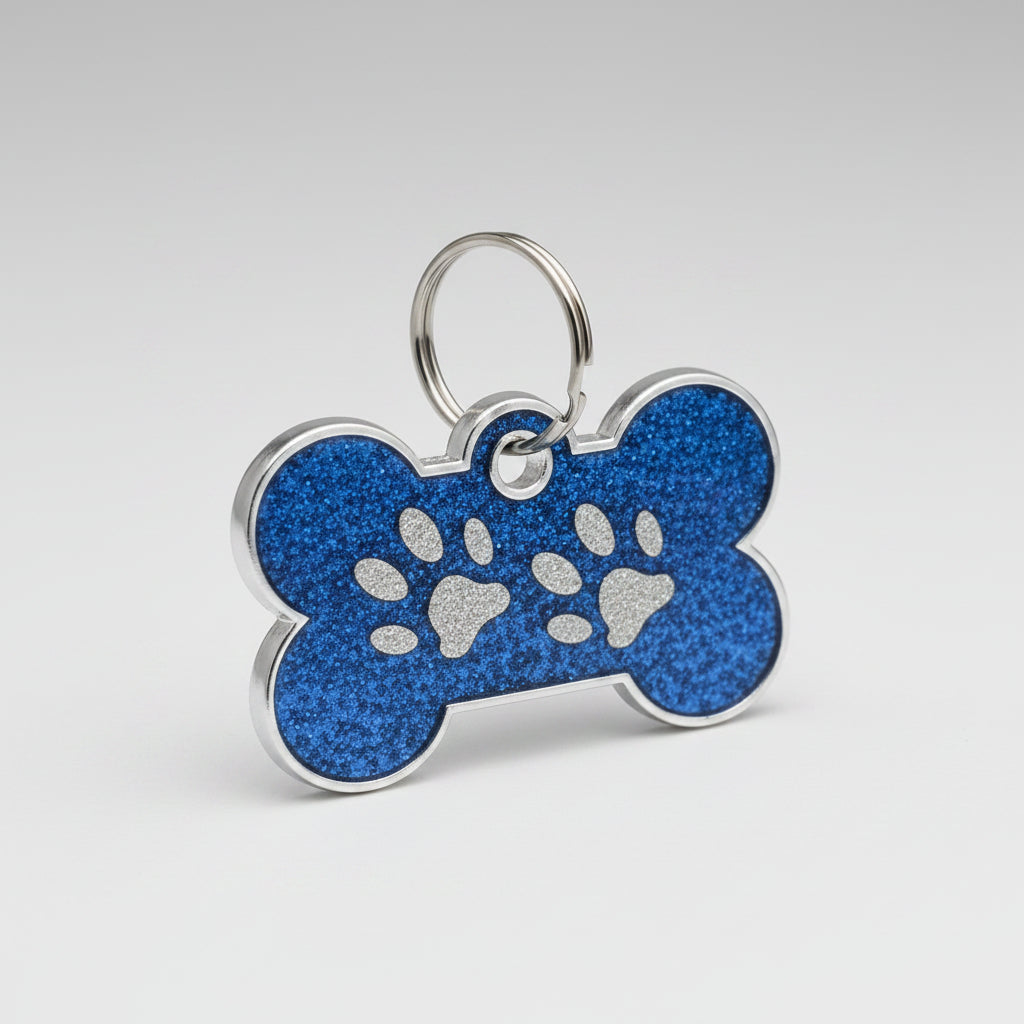 Blue bone-shaped pet tag with paw print design on a white background