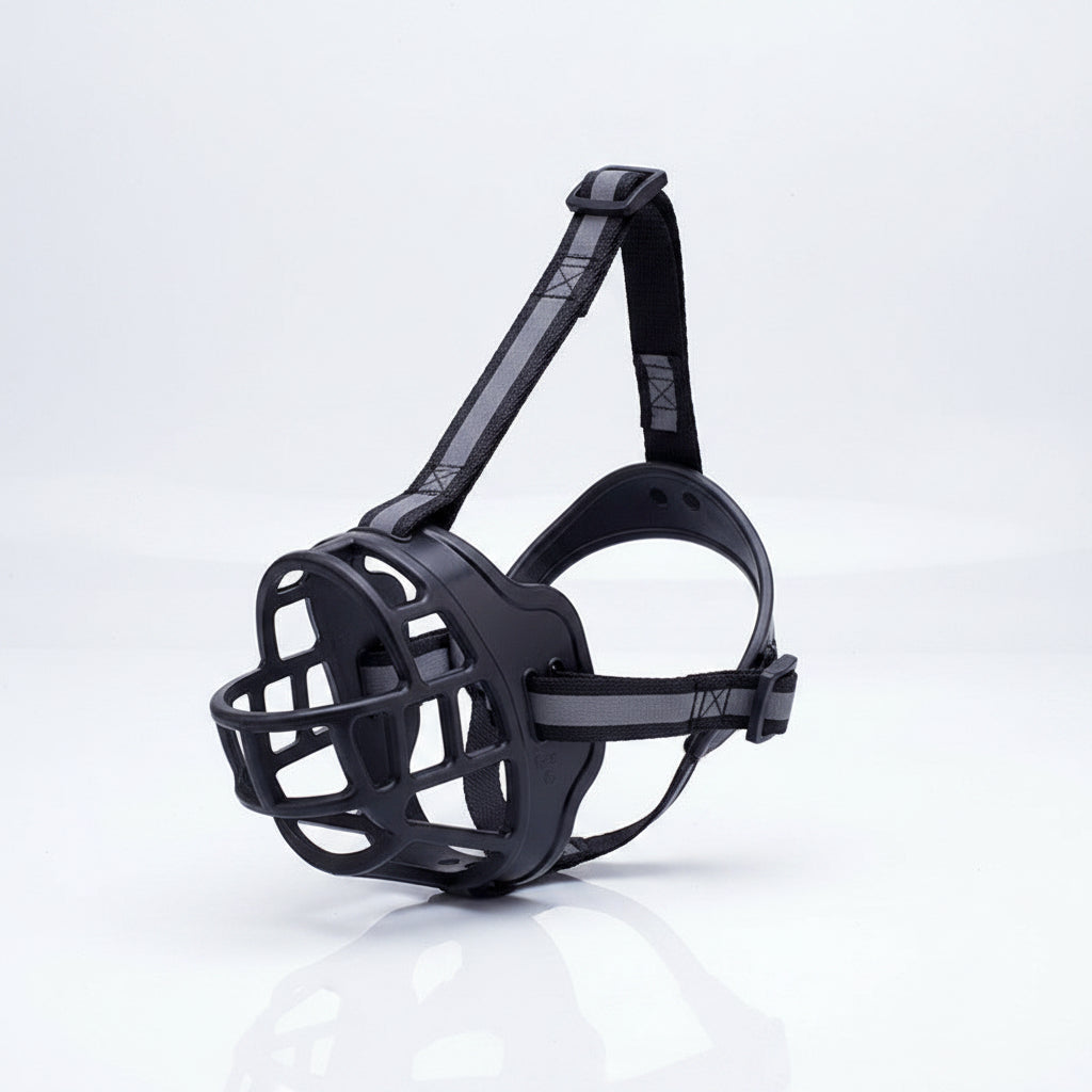 Black dog muzzle with straps on a white background