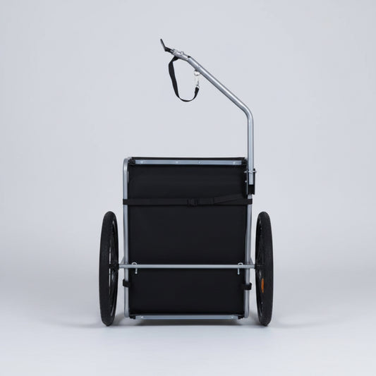 Black wheelbarrow with a handle on a white background